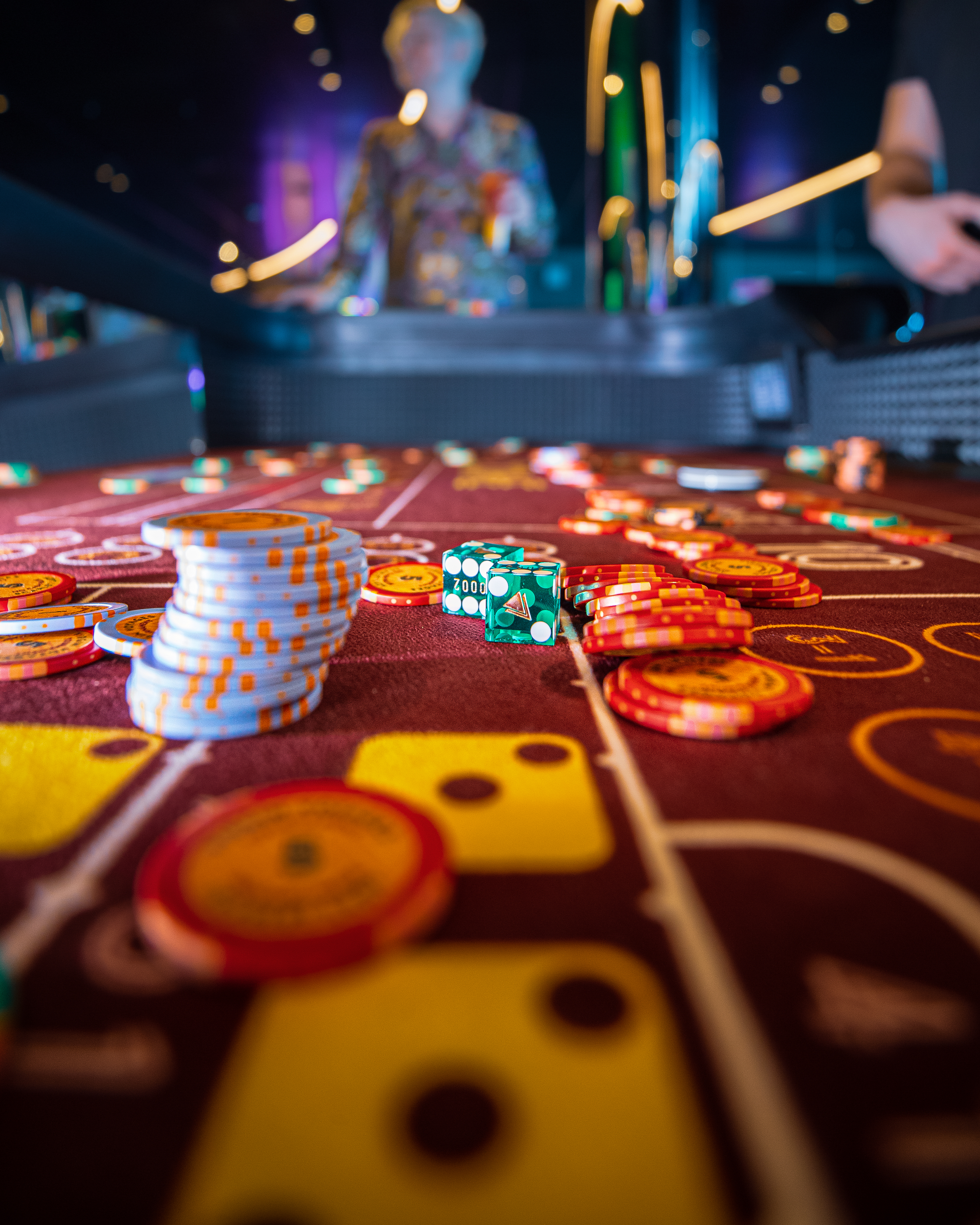 Casino table with chips and dice aboard a Virgin Voyages ship