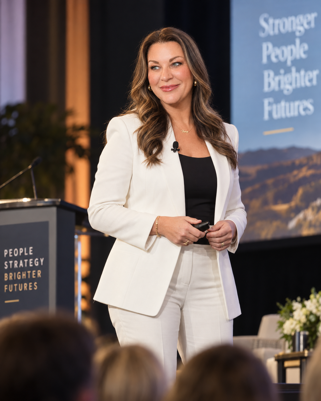 Tara Furiani speaking on stage at the People Strategy Brighter Futures conference