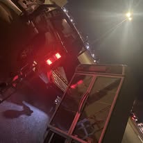 Junk removal truck loaded up at night