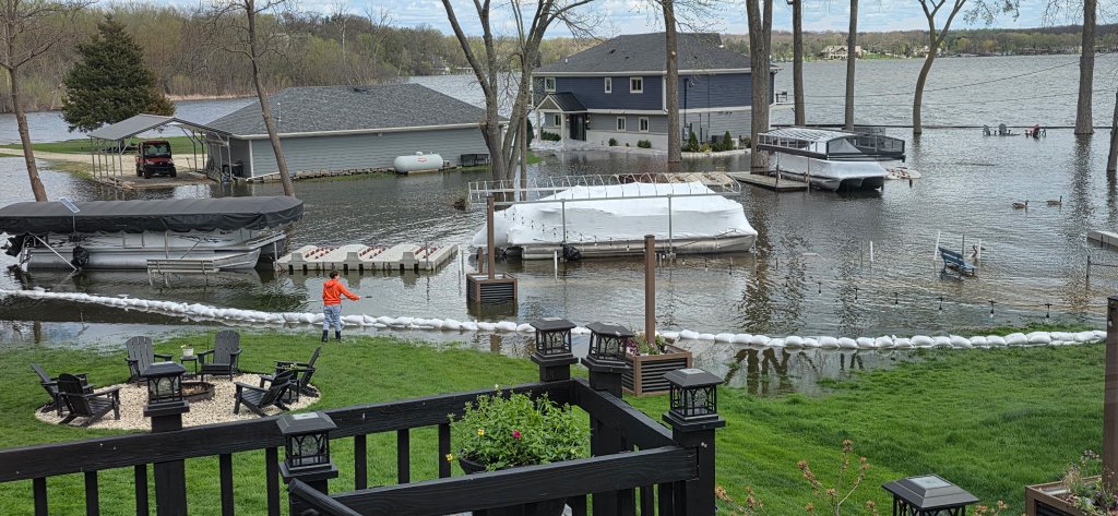 Lakefront properties with sandbag barriers as water levels rise in Chain O' Lakes