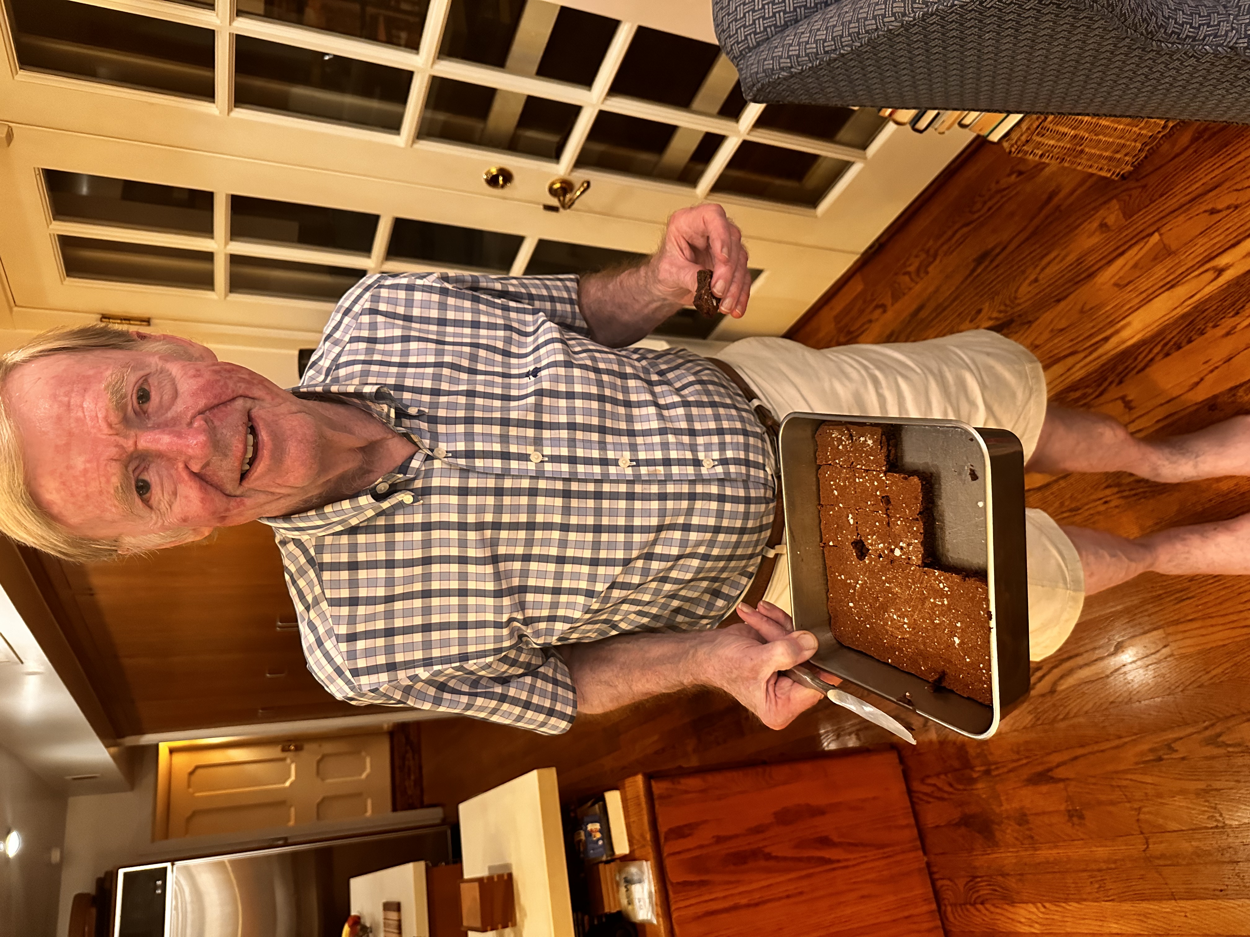 George IV Brumder holding a tray of Brumder Brownies