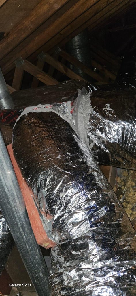 HVAC ductwork joint sealed with mastic in attic