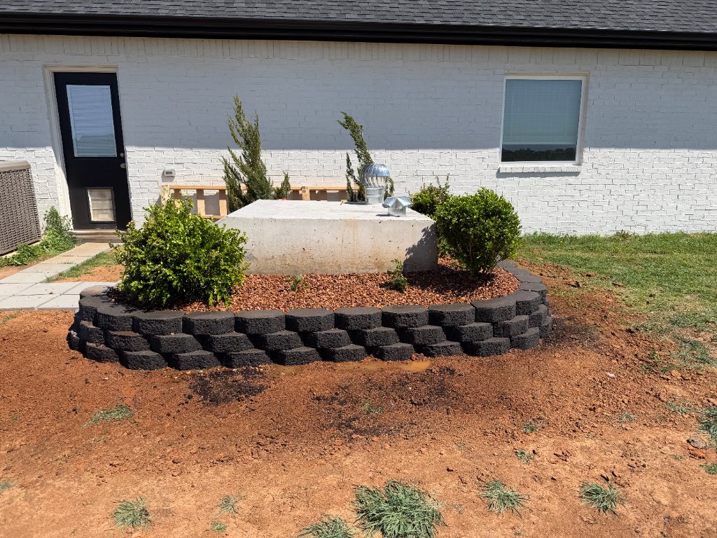 New shrubs and upright evergreens in an ATS residential planting bed in Stillwater