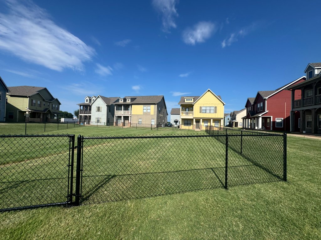 Black chain-link commercial dog park fence installed in Stillwater Oklahoma