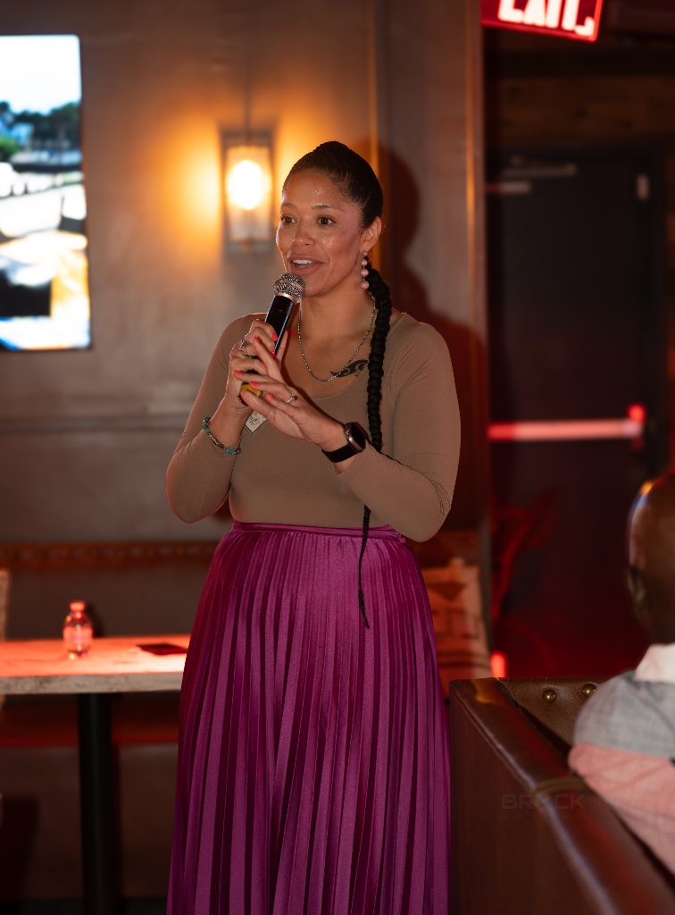 Lacey speaking with mic