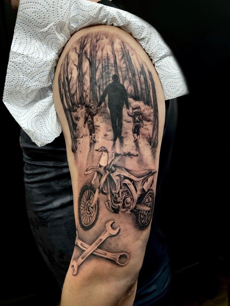 Black and grey half sleeve tattoo by Daz G in Birmingham with memorial portrait detail