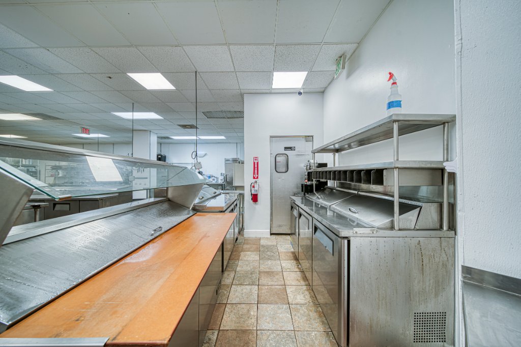 Food service prep line between stainless steel stations