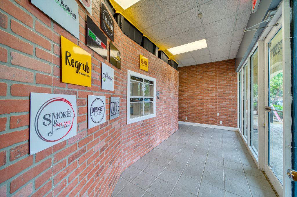 Entrance hallway with tenant brand signage wall