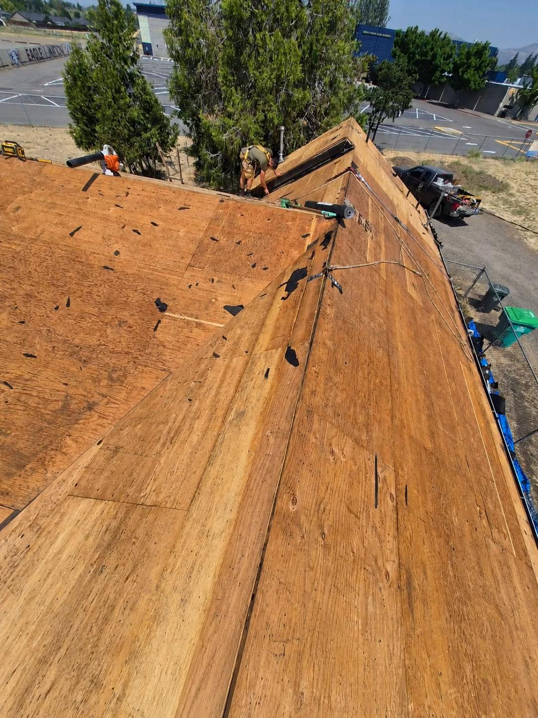 Roof torn off exposing wood decking before installation by Element Zero Roofing