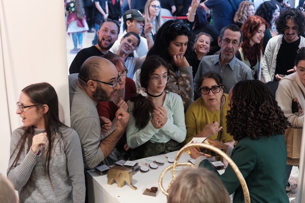 Chocolatier interacting with customers