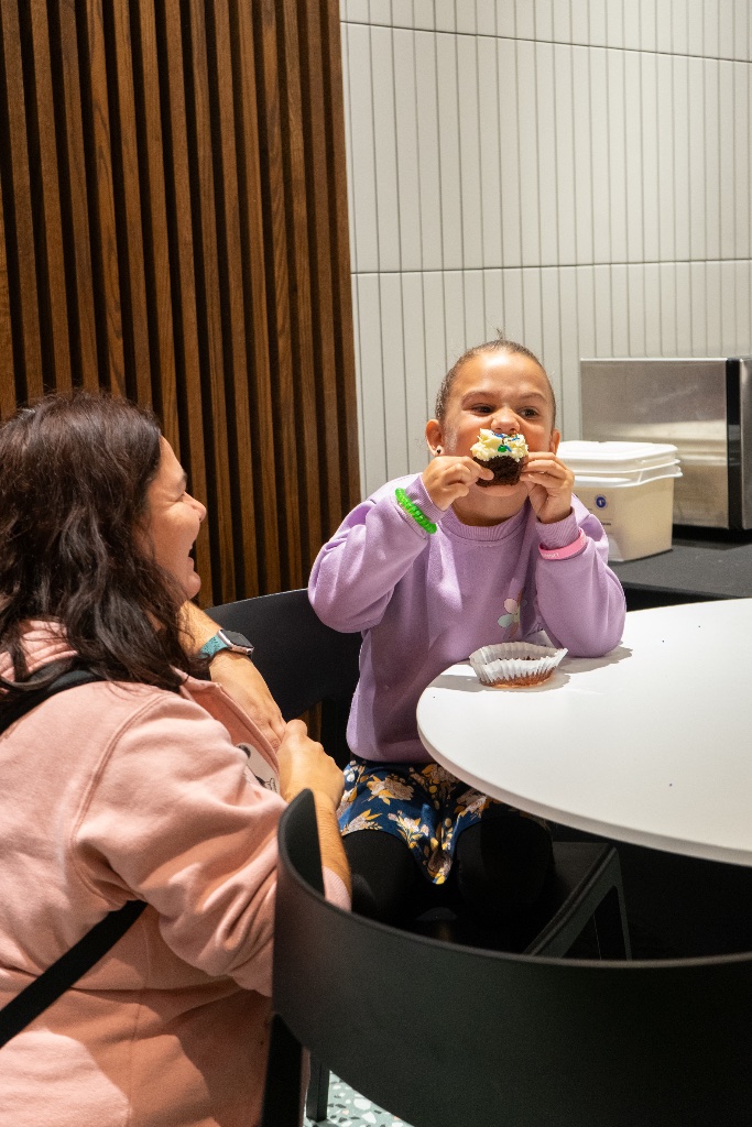 Young visitor enjoying a chocolate treat