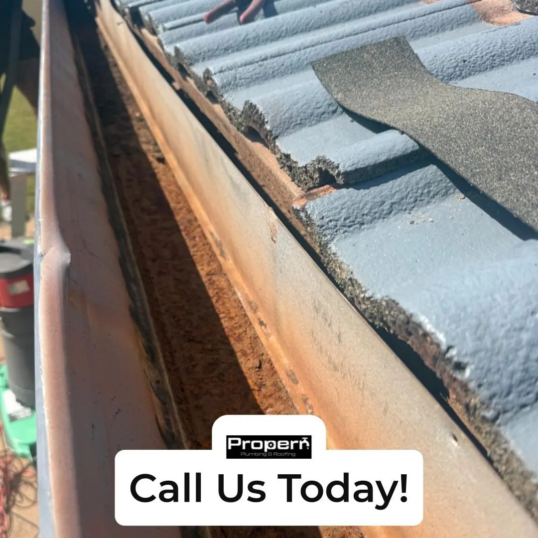 Rusted box gutter found during a roof inspection, before replacement