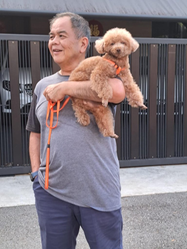 Richard carrying Yatou on a morning walk