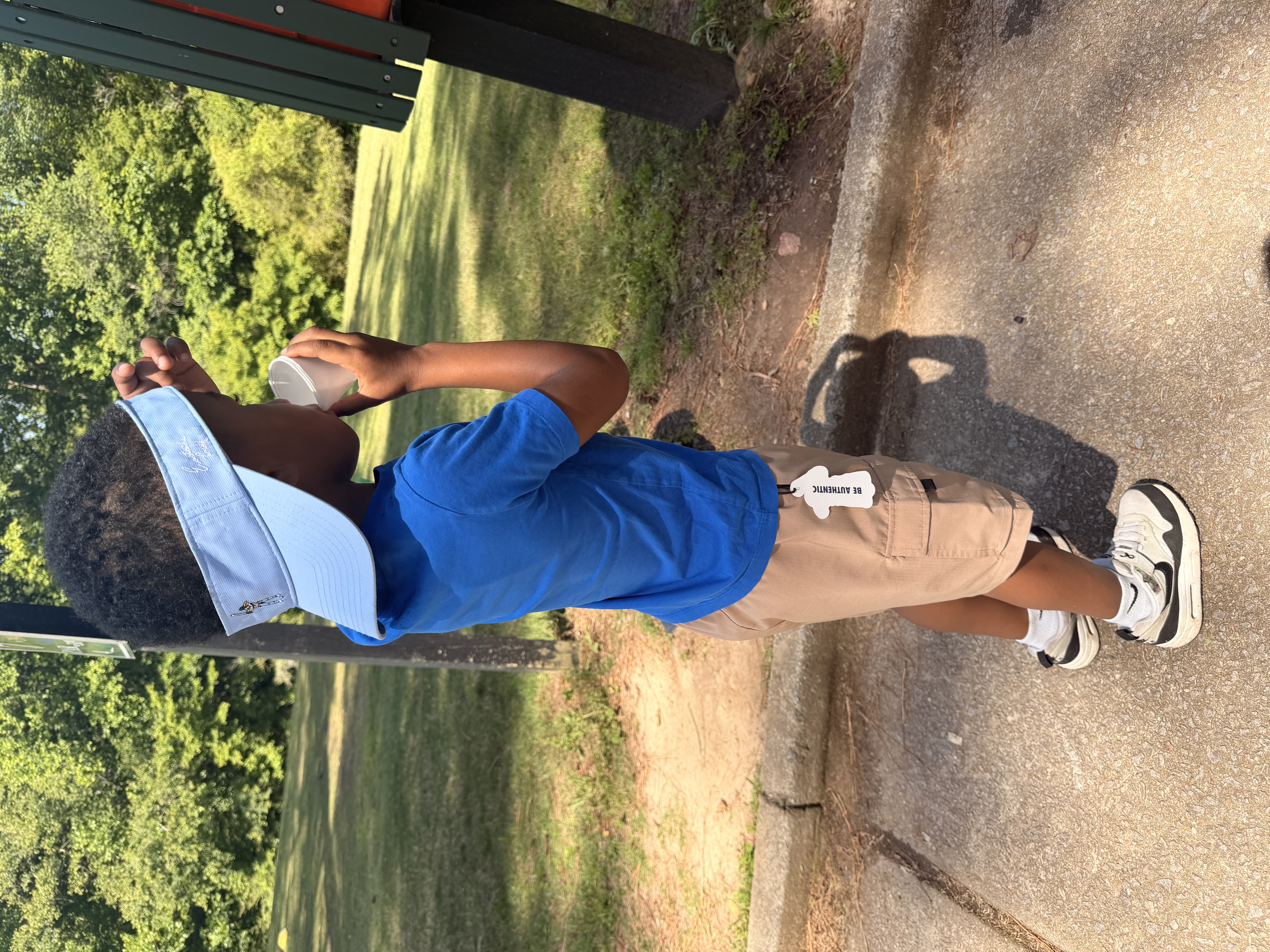 Young golfer in a visor ready to play