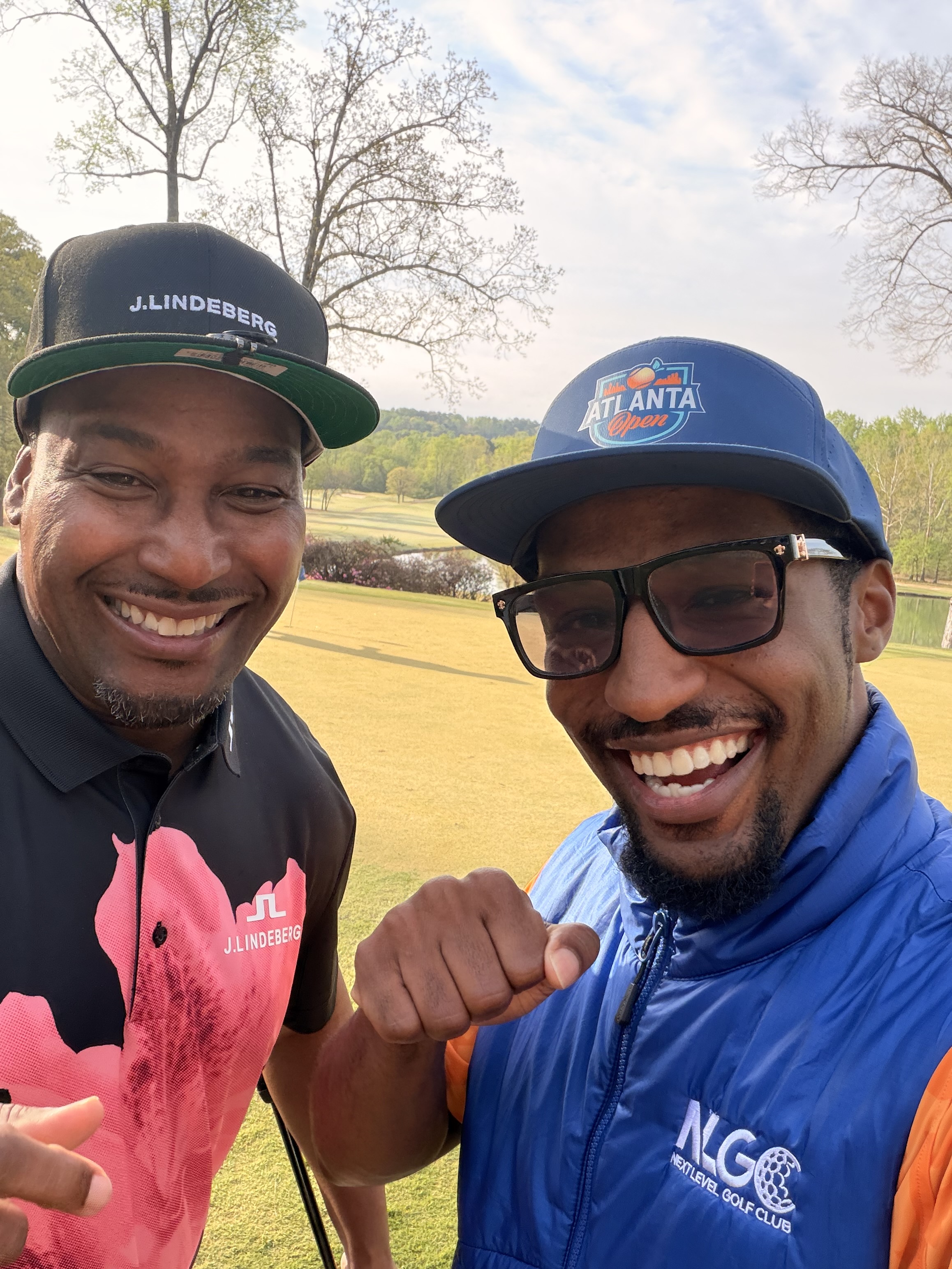 Two golfers taking a selfie on the course