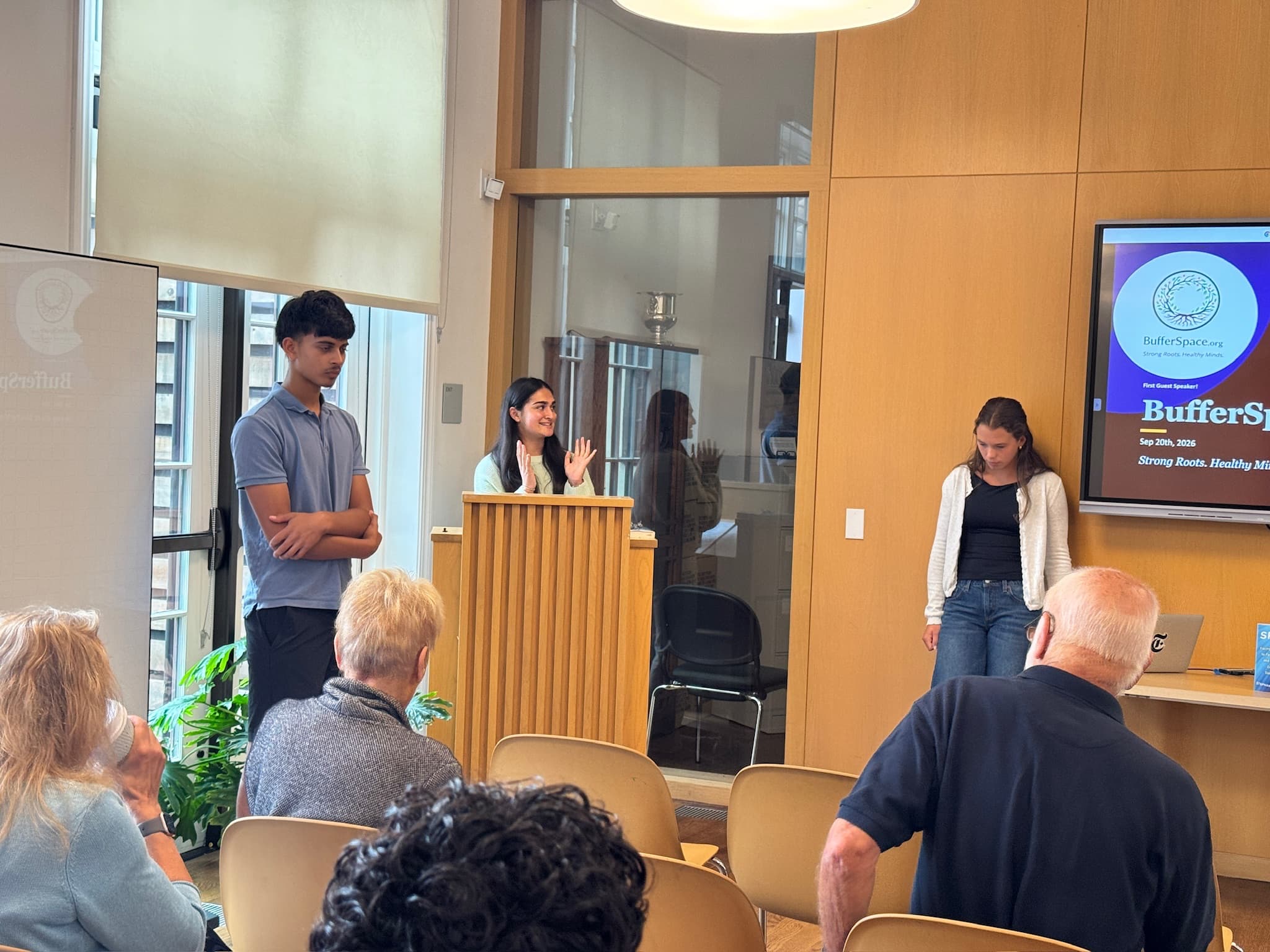 The student team welcomes attendees as the program begins