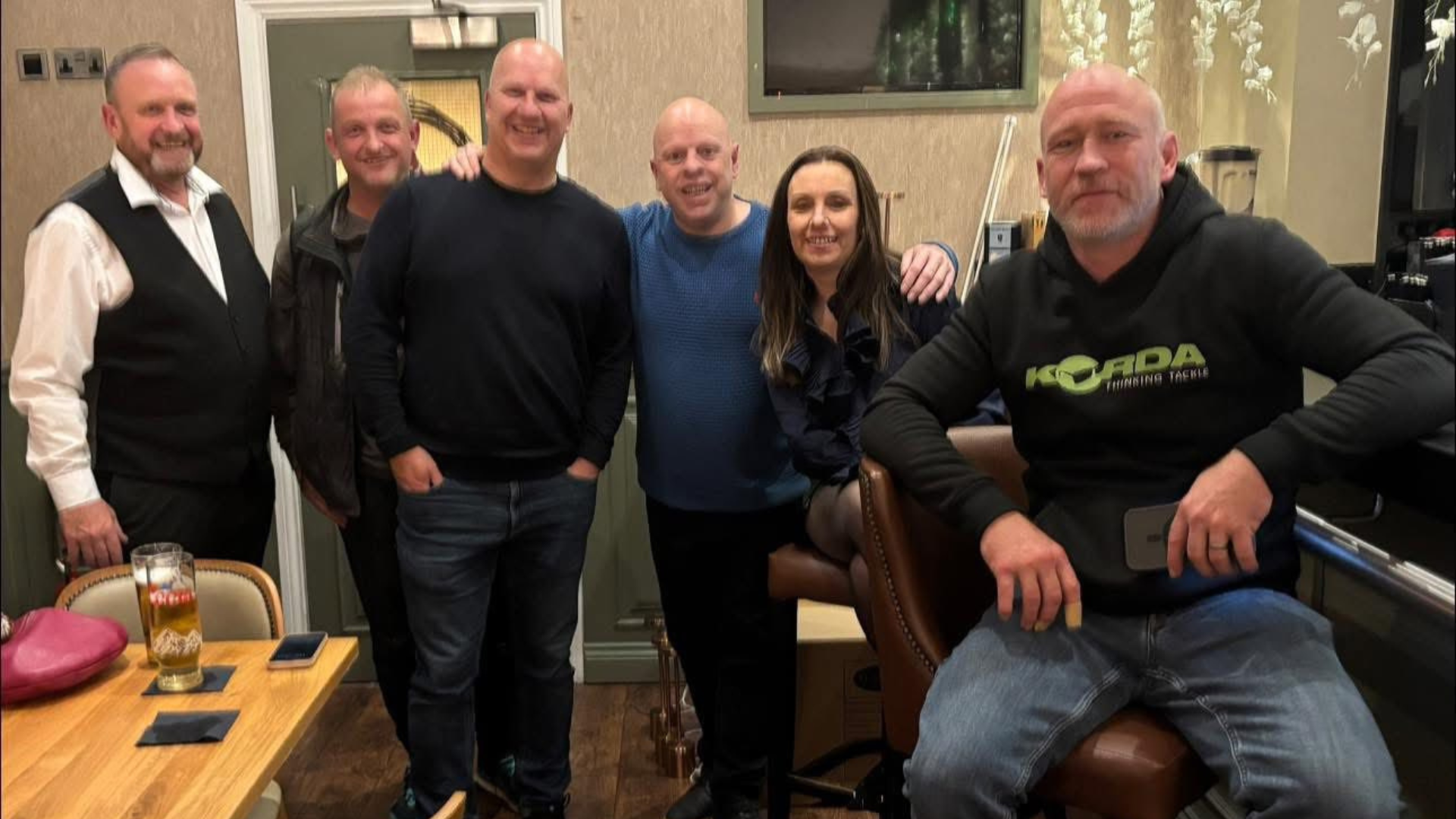 A mixed group of tradespeople networking together
