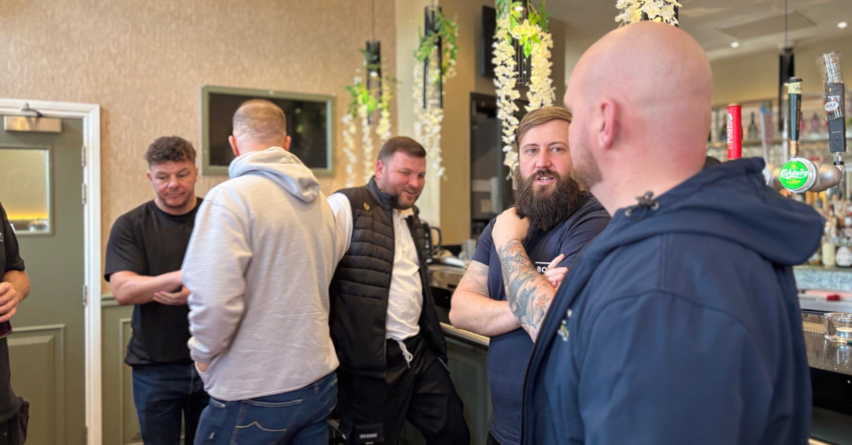 Tradespeople chatting at a networking event