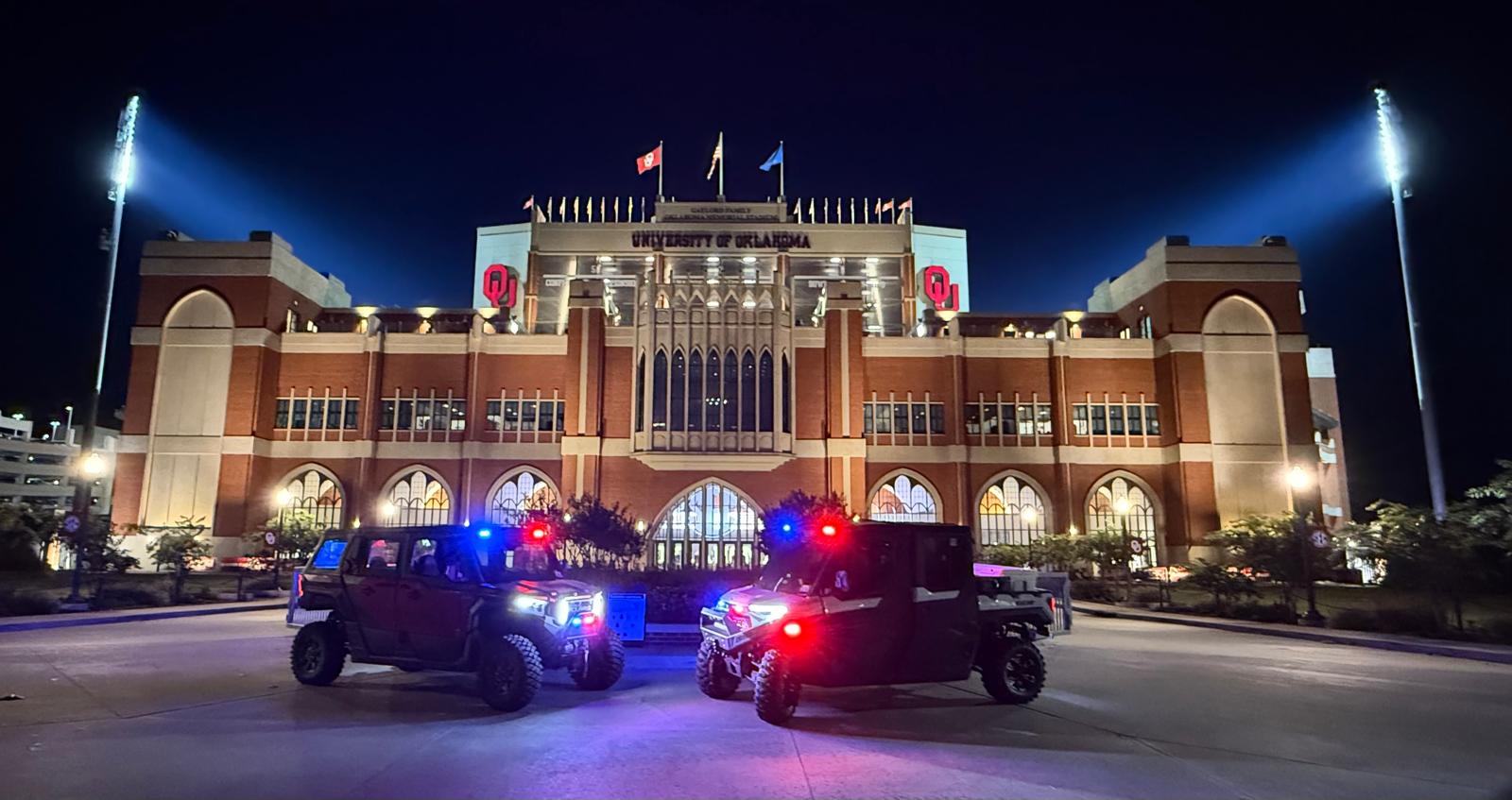 Oklahoma Response side-by-sides staged in front of the University of Oklahoma Memorial Stadium at night