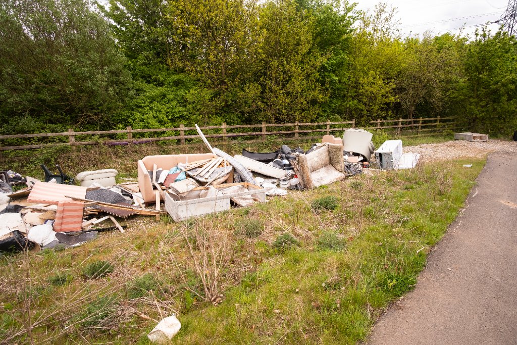 Bulky waste fly-tipped in a rural area