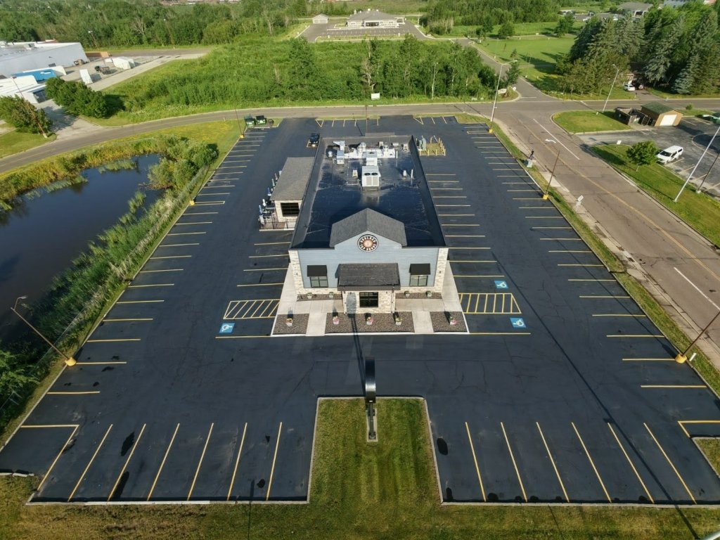 Aerial view of commercial building and parking lot