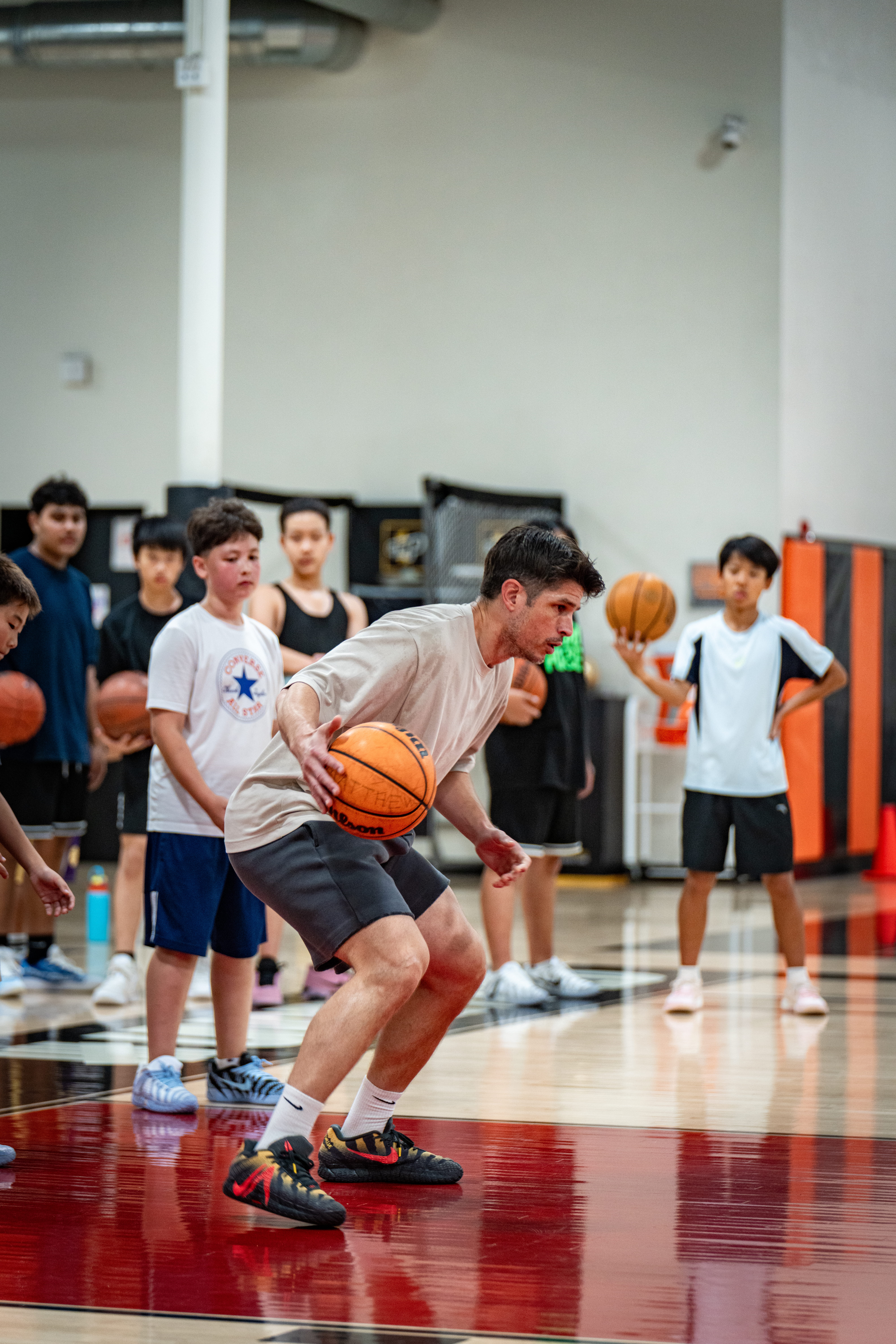 Coach demonstrating a dribbling stance
