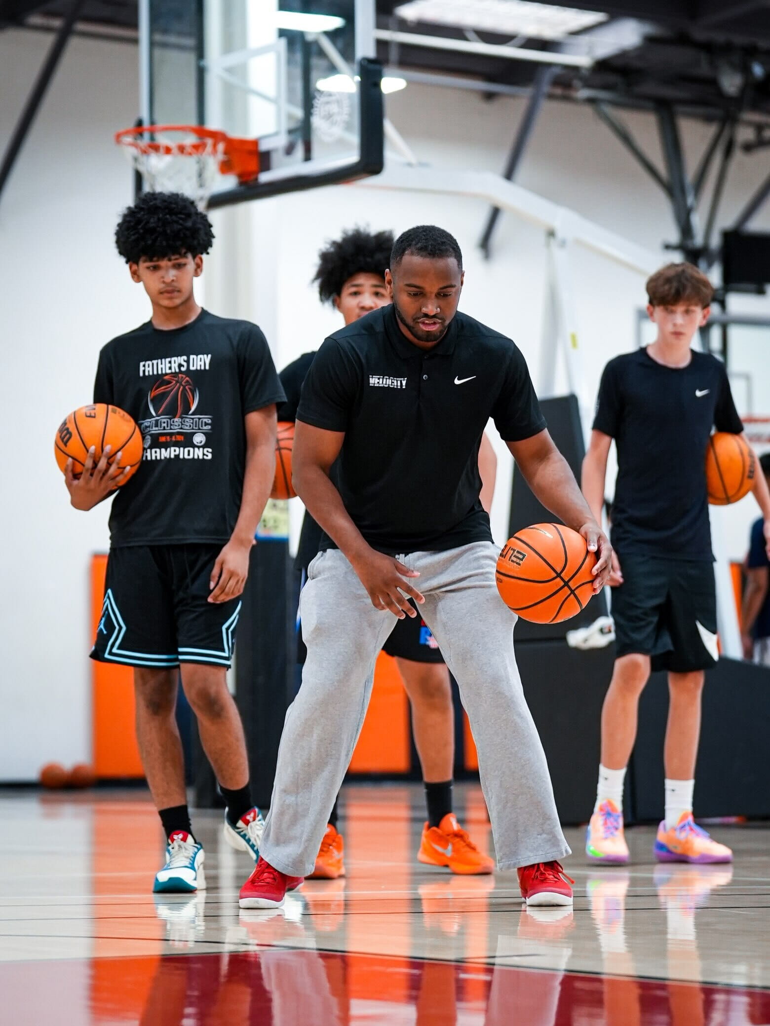 Velocity HQ coach demonstrating a ball-handling drill