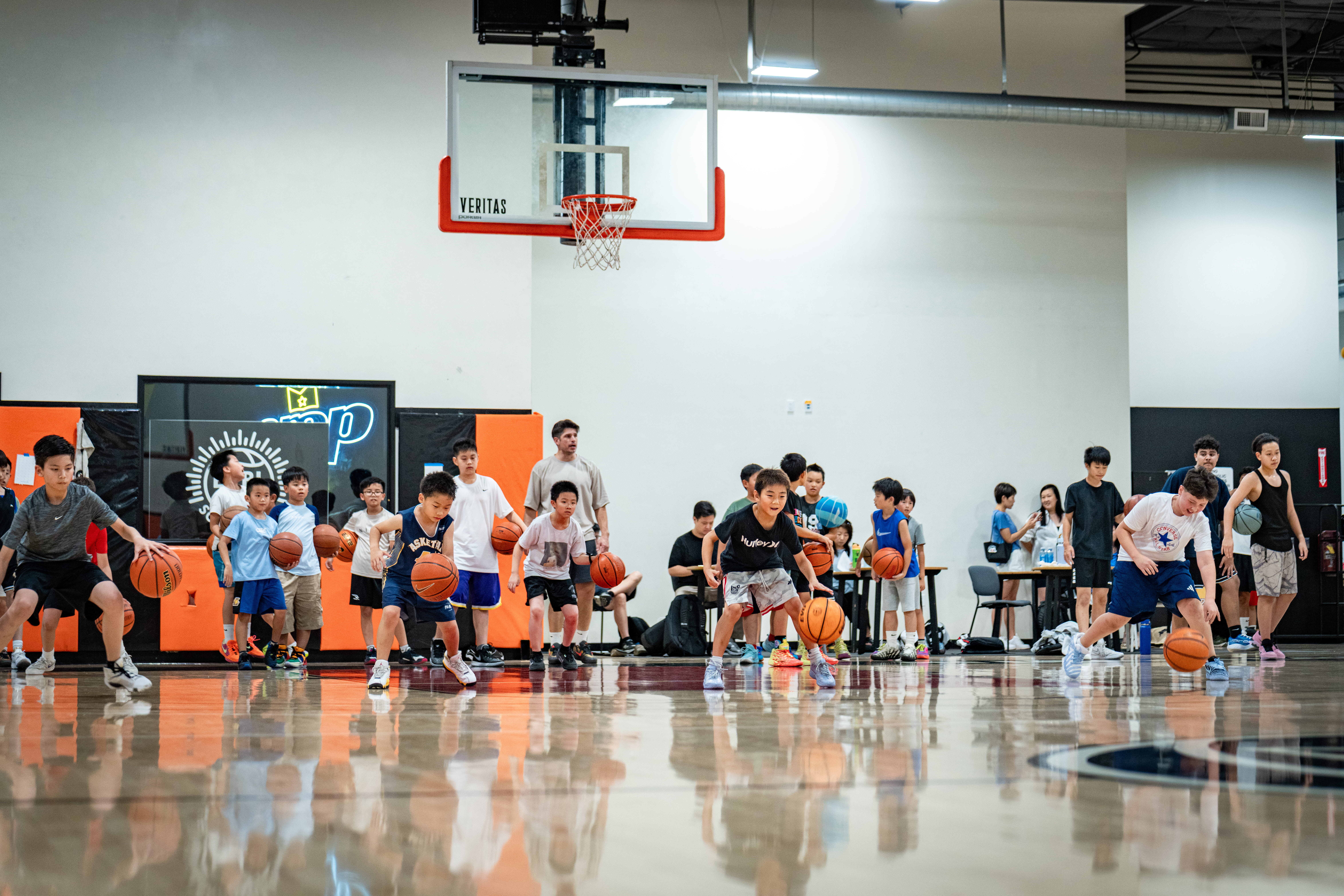 Players running dribbling drills with a coach at Velocity HQ
