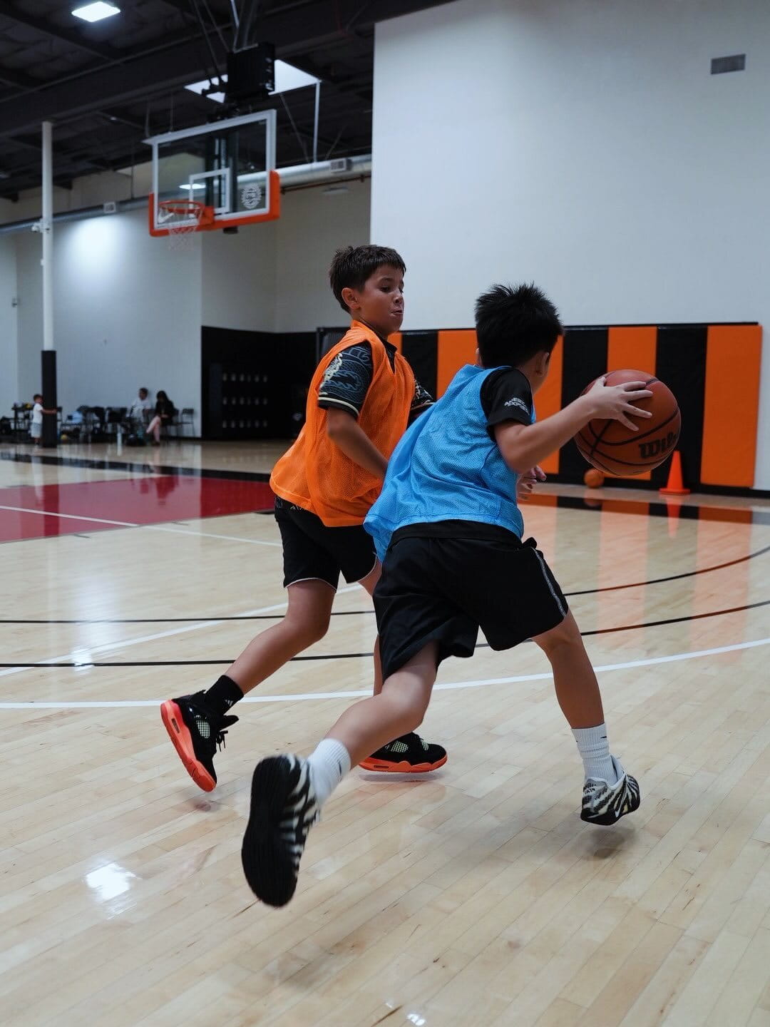 Players running dribbling drills on the Velocity HQ court