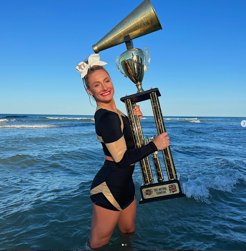 Grace with national championship trophy