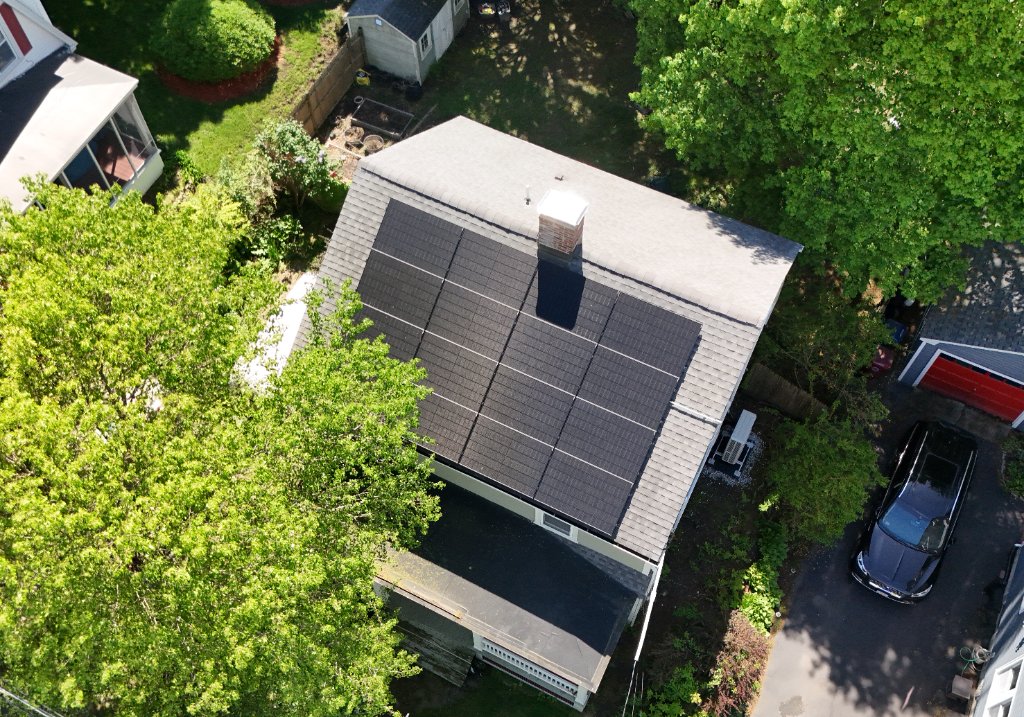 Aerial view of home with solar panels installed