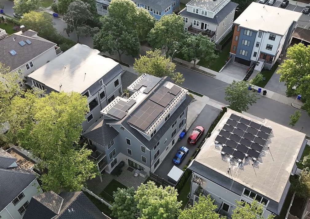 Aerial view of solar panel installation on residential homes