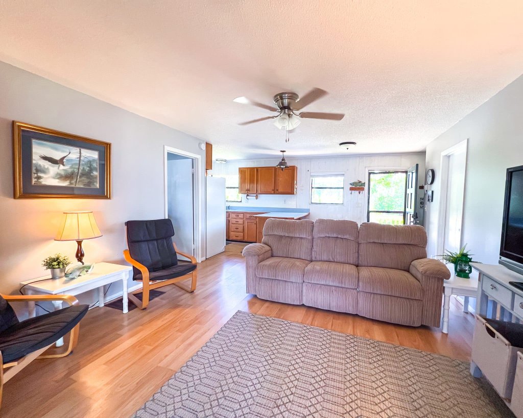 Comfortable sofa and armchairs with eagle artwork