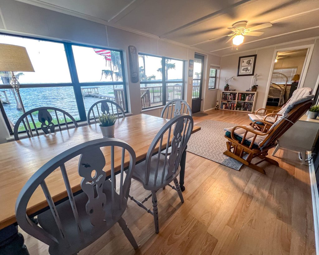 Dining table with picture window overlooking the lake and dock