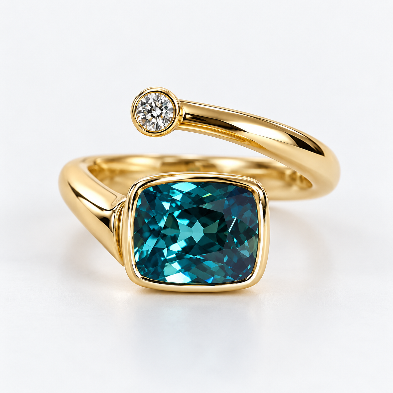 Custom yellow gold bypass ring with a cushion-cut teal gemstone and round diamond