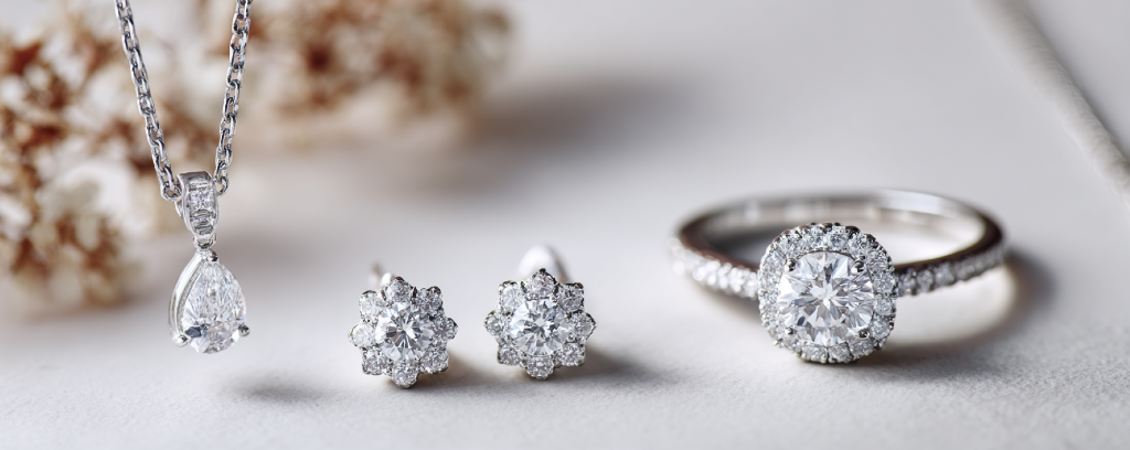 Collection of custom engagement rings handcrafted at Brahim's Jewelry in Burlington Massachusetts, featuring round, oval, and pear shaped diamonds in white gold and platinum