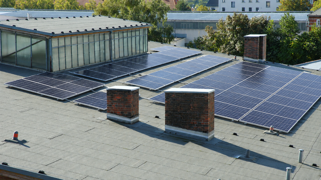 Flat commercial roof with solar panel installation