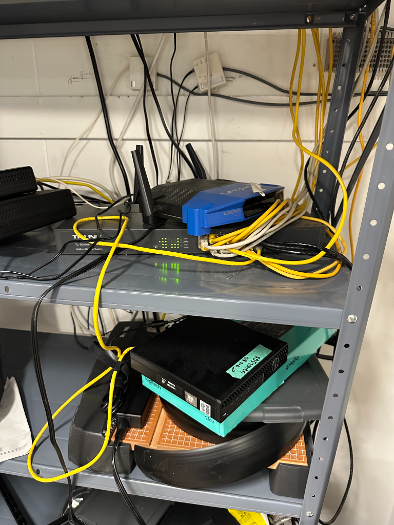 Before — messy network setup with tangled cables