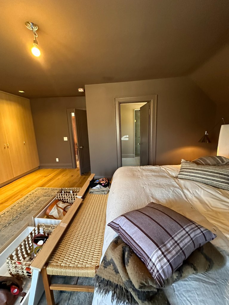 Room with green accent wall painting