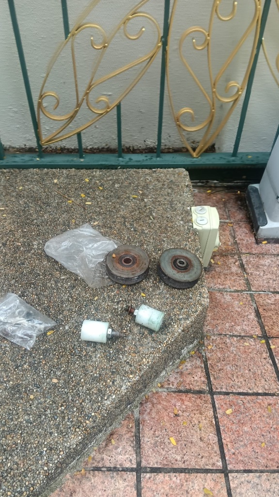 Sliding Gate Roller Replacement & Preventive Maintenance — Before — Worn Rollers Removed