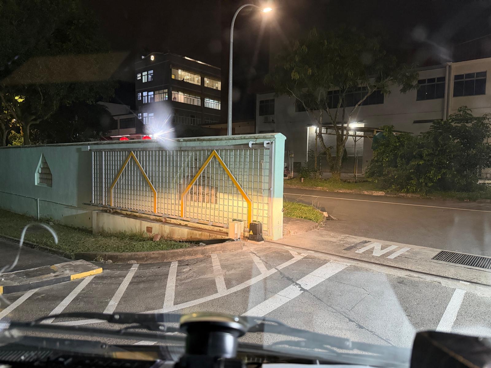 Liberty Warehouse Integrated Security & Automation — Entry Gate at Night