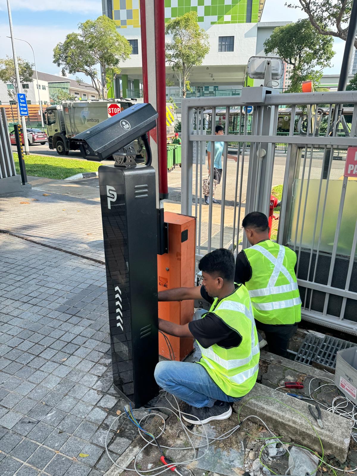 Questa @ Dunman Integrated Security & Vehicle Access — Technicians Installing LPR Totem