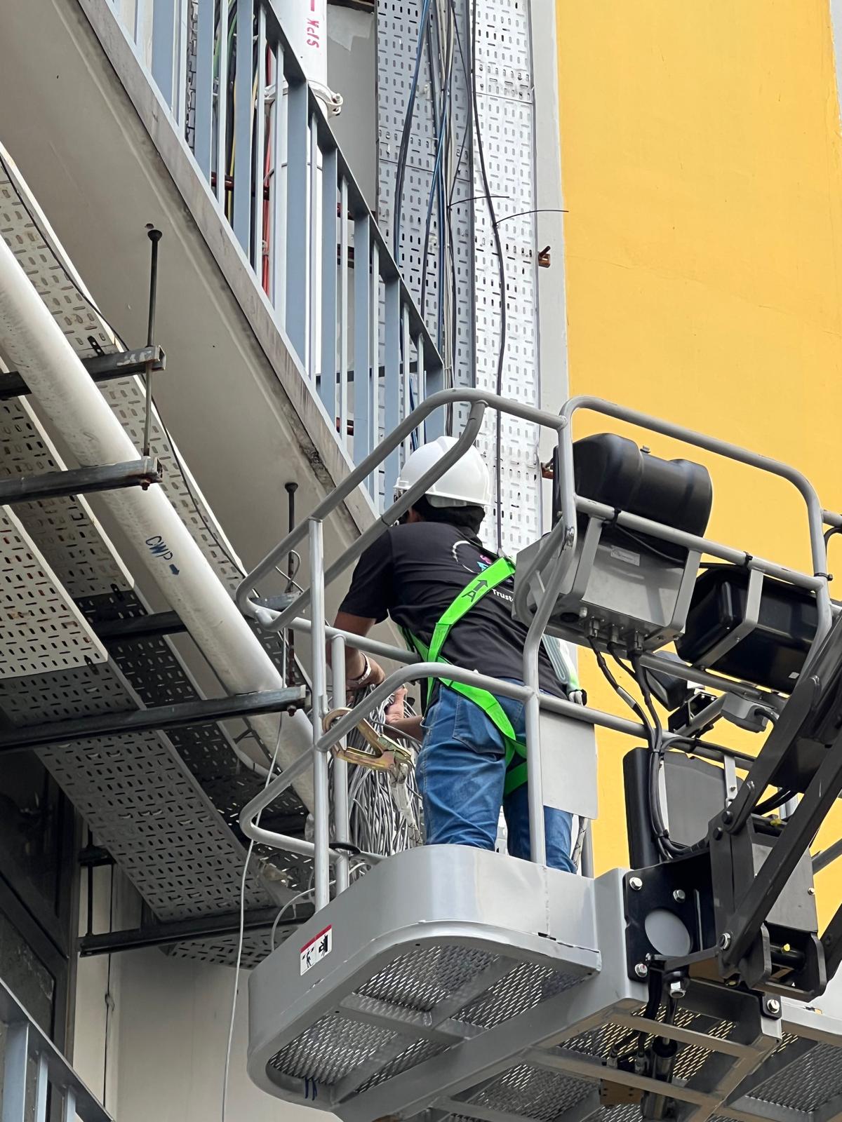 Woodlands Connection Integrated Security & Electrical Systems — Cable Tray Installation on Facade