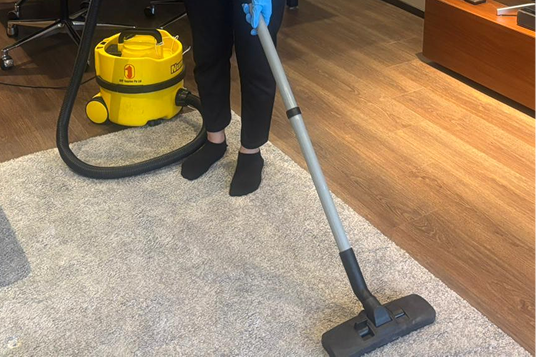 Vacuuming carpeted floors
