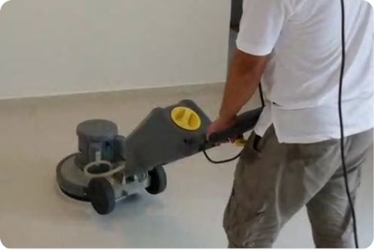 Floor polishing with a scrubber machine