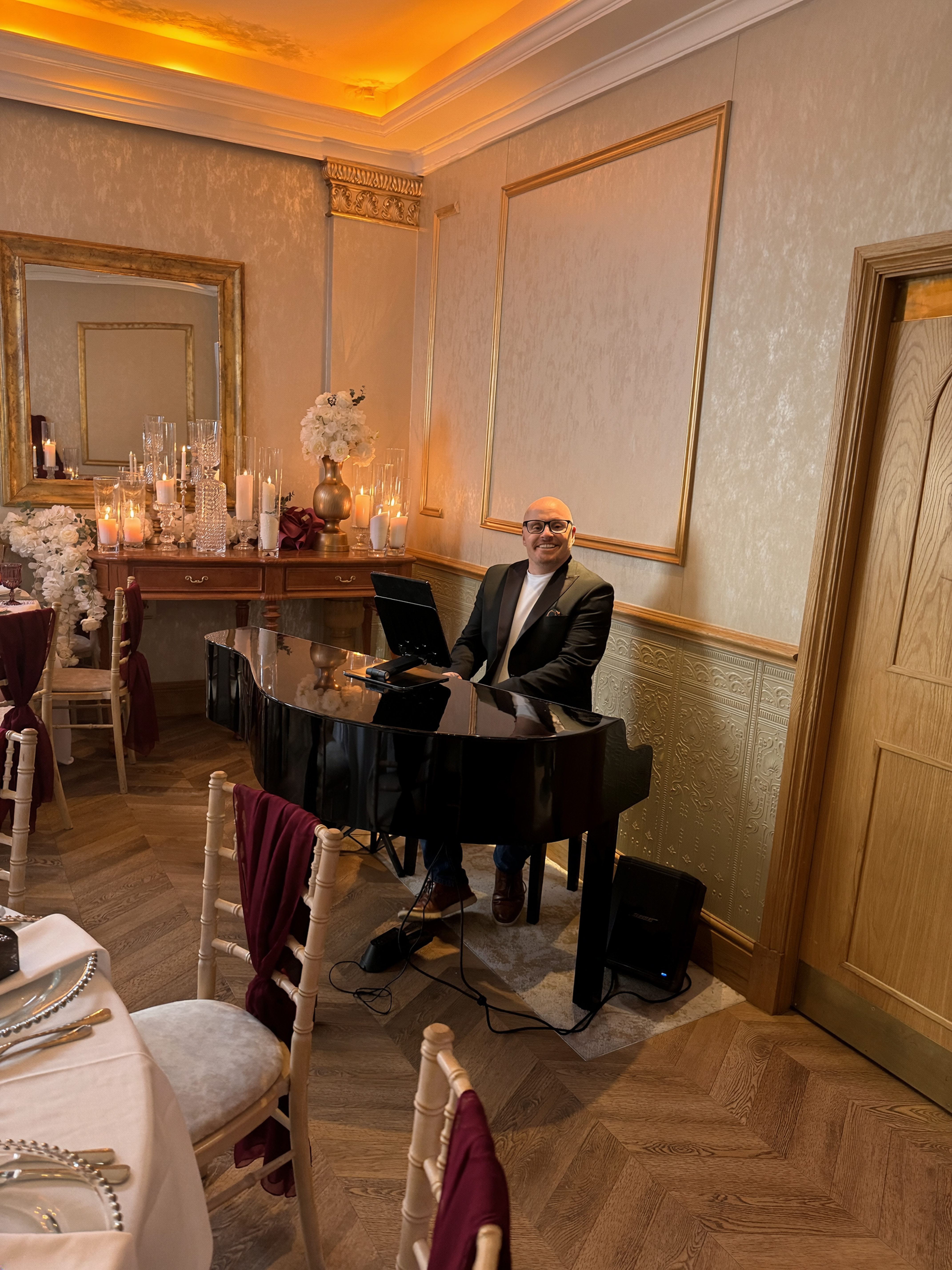 Rob Price performing at his black baby grand piano