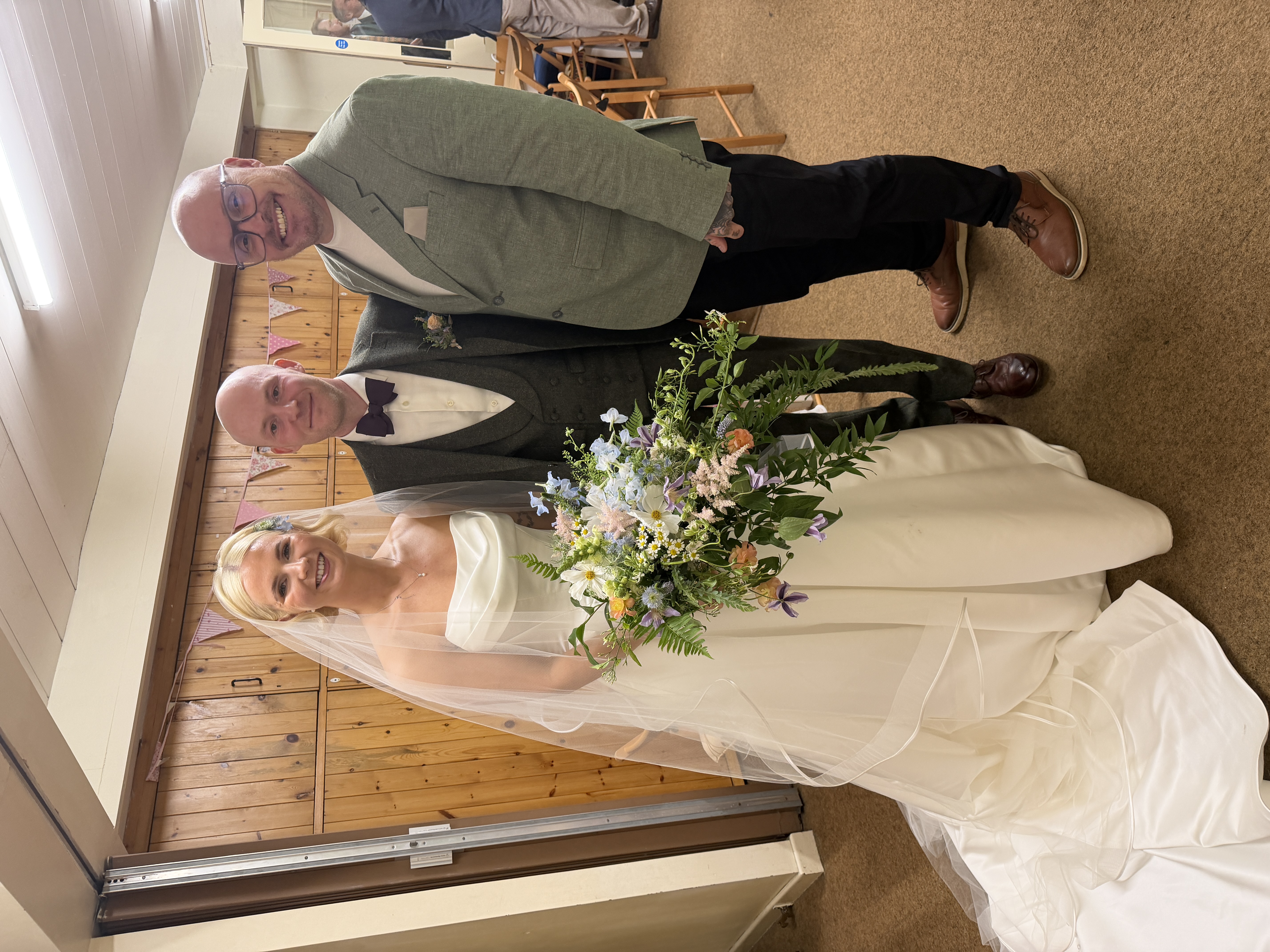 Becky Parsons with the happy couple on their wedding day