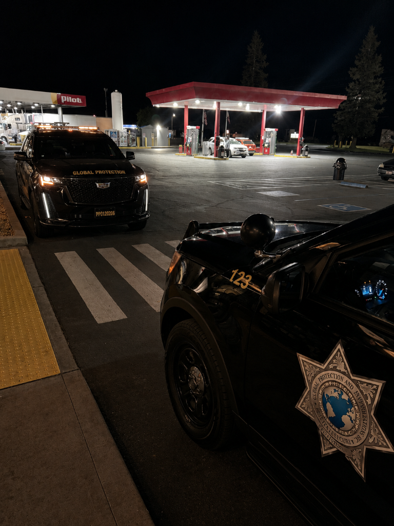 GPI Security officer stepping out of marked patrol vehicle at night at commercial property in Sacramento