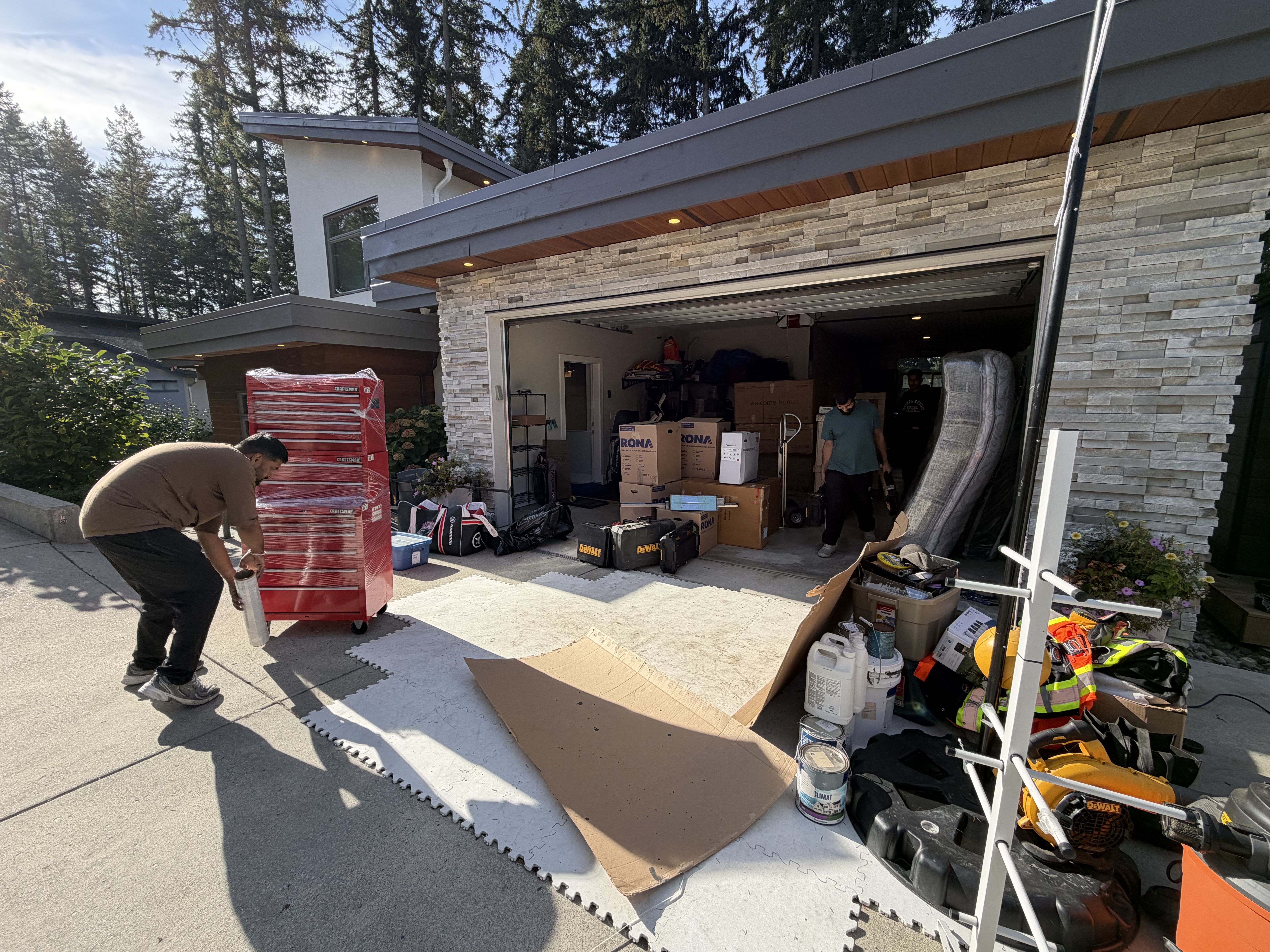 Loading day — tool chest wrapped and boxes staged on the driveway