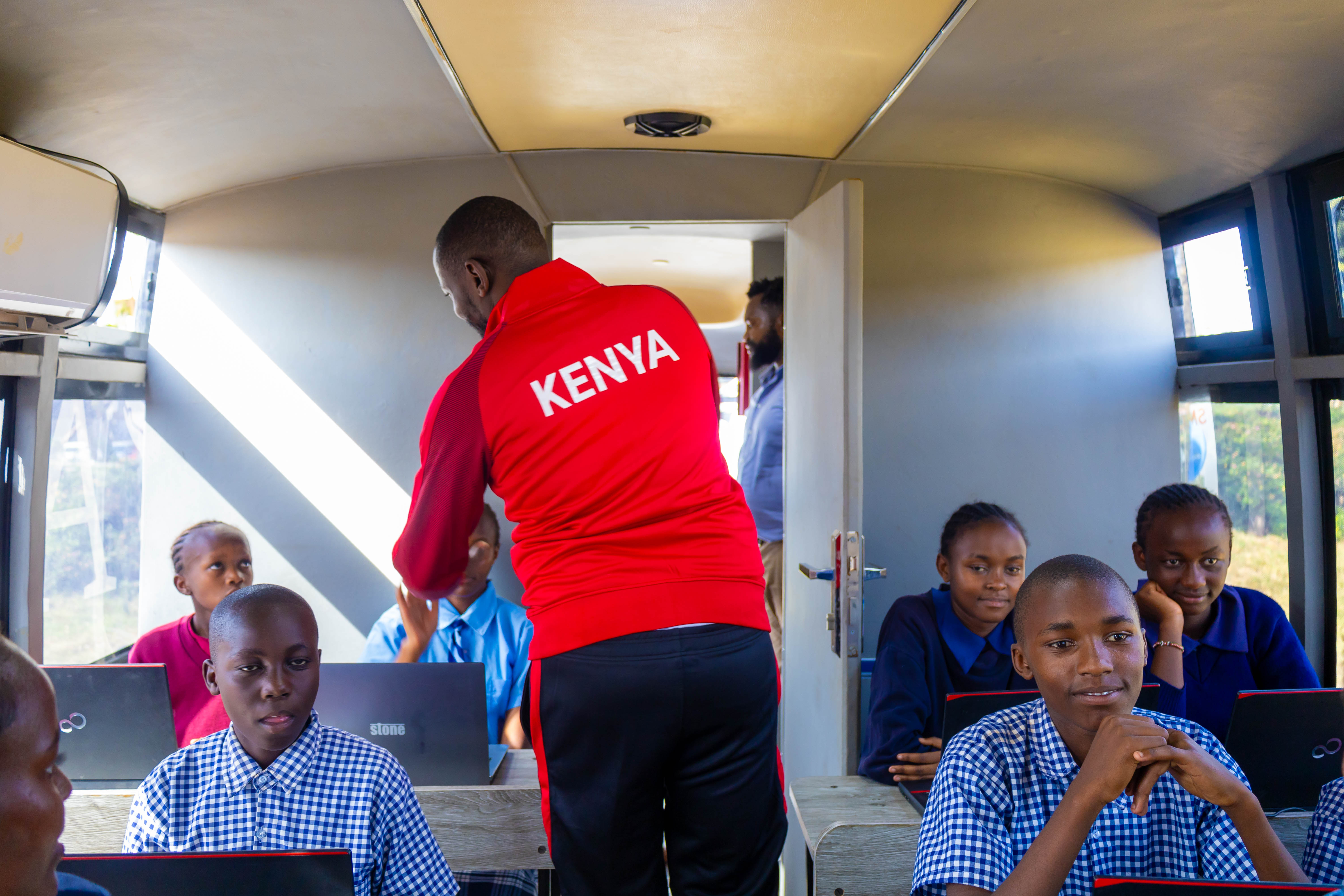 Instructor teaching students inside the Digi AI Bus